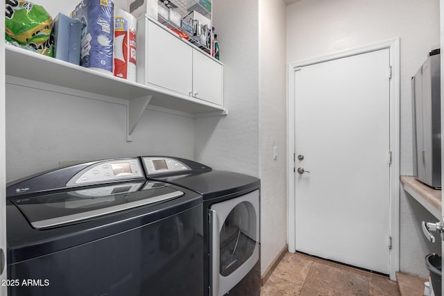 13629 W San Miguel Ave, Litchfield Park, AZ 85340 - laundry room with cabinet space, washer and dryer, and stone tile floors