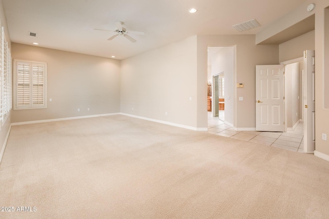 empty room featuring light tile patterned floors, ceiling fan, recessed lighting, light colored carpet, and visible vents