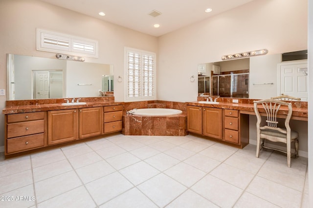 full bathroom featuring a garden tub, a stall shower, a sink, and visible vents