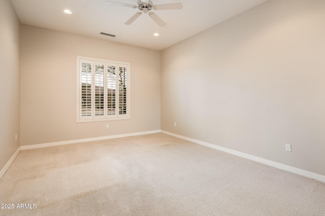 carpeted spare room featuring a ceiling fan, recessed lighting, visible vents, and baseboards