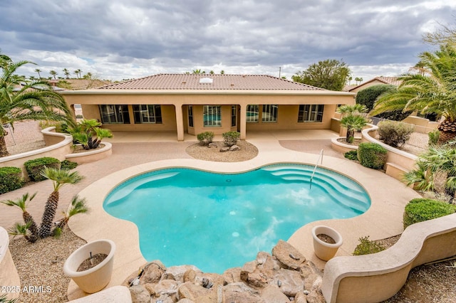 view of pool featuring a patio area