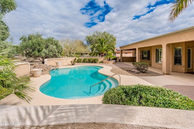 pool featuring a patio area