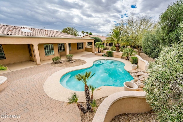 pool featuring a patio area