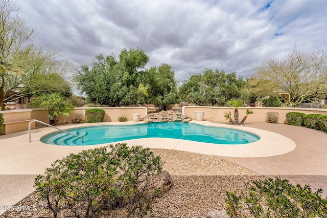 pool featuring a patio area