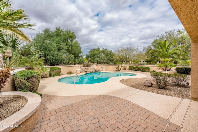 outdoor pool with a patio