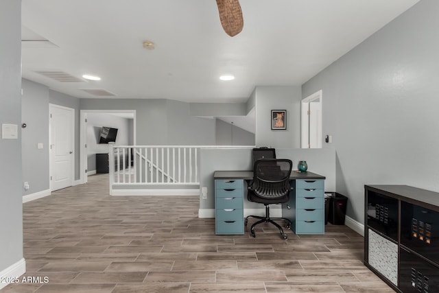 office featuring wood tiled floor and baseboards