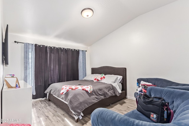 7310 N 68th Ln, Glendale, AZ 85303 - bedroom featuring lofted ceiling and wood finished floors