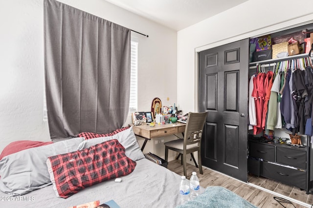 7310 N 68th Ln, Glendale, AZ 85303 - bedroom with wood finished floors and a closet