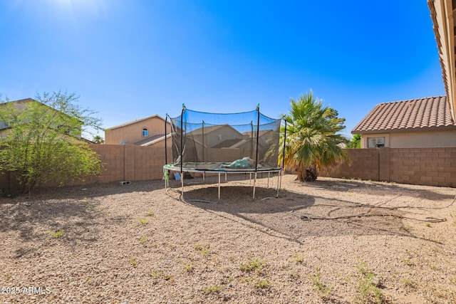 7310 N 68th Ln, Glendale, AZ 85303 - fenced backyard with a trampoline