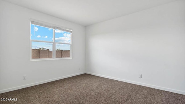 1337 W Hess Ave, Coolidge, AZ 85128 - unfurnished room featuring dark colored carpet and baseboards