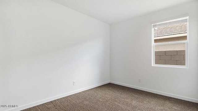 1337 W Hess Ave, Coolidge, AZ 85128 - carpeted empty room with baseboards