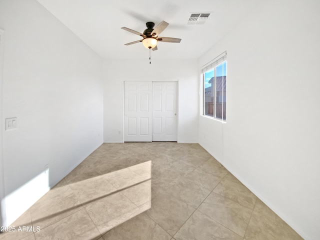 empty room featuring ceiling fan