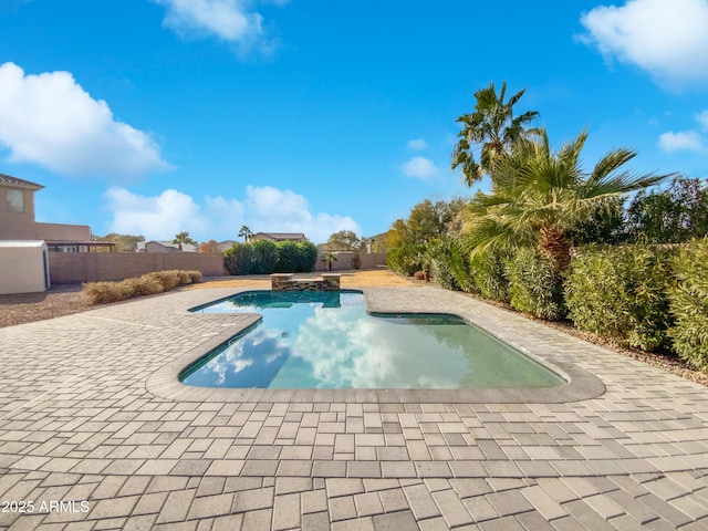 view of swimming pool featuring a patio area