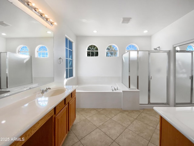 bathroom featuring vanity, tile patterned flooring, plenty of natural light, and shower with separate bathtub