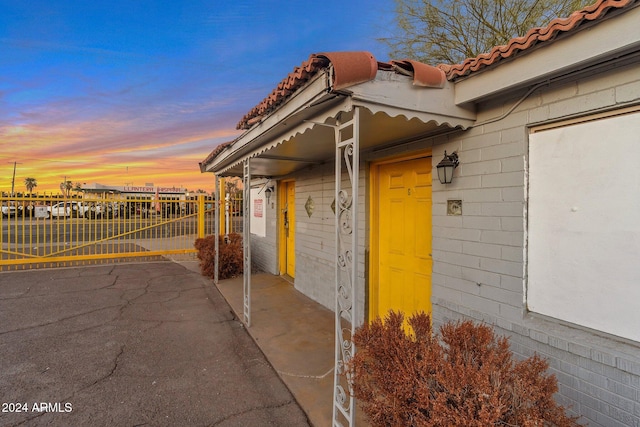 view of exterior entry at dusk