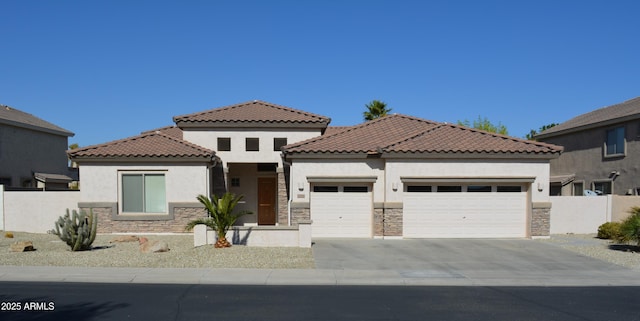 mediterranean / spanish-style house with a garage