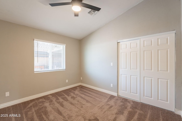 4001 E Apollo Rd, Phoenix, AZ 85042 - unfurnished bedroom featuring vaulted ceiling, carpet flooring, a closet, and a ceiling fan