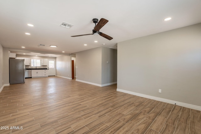 4001 E Apollo Rd, Phoenix, AZ 85042 - unfurnished living room with ceiling fan, light wood finished floors, and recessed lighting