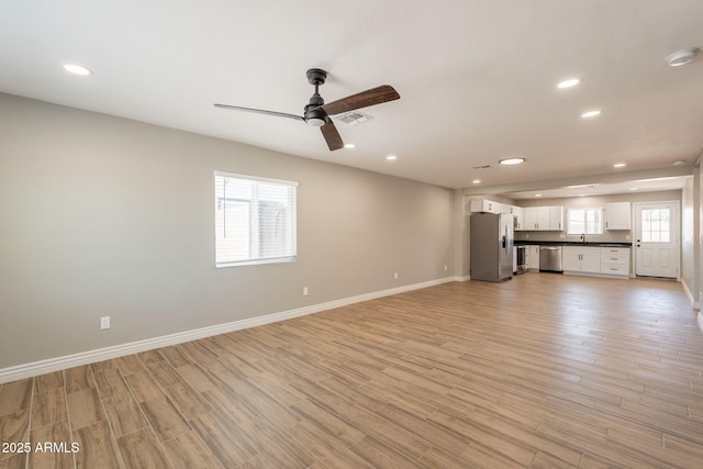 4001 E Apollo Rd, Phoenix, AZ 85042 - unfurnished living room featuring ceiling fan, recessed lighting, and light wood-style floors