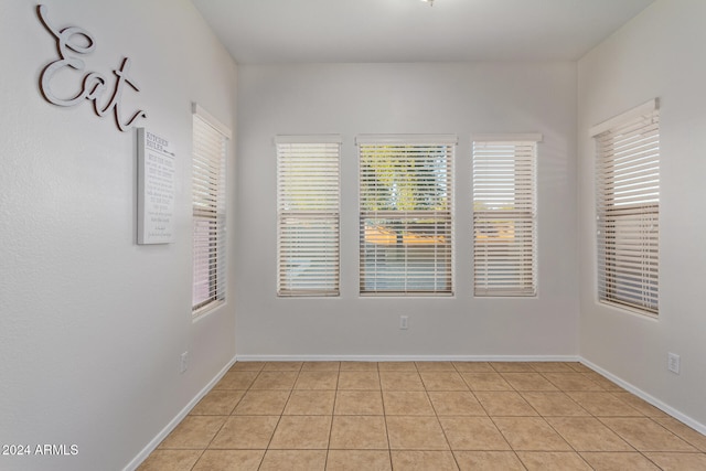 spare room featuring light tile patterned floors