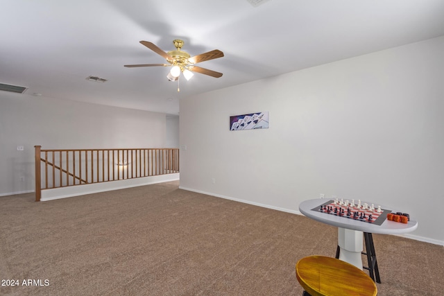 interior space with ceiling fan