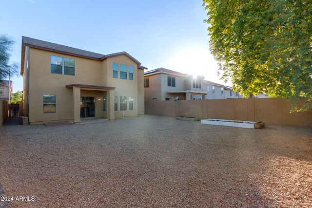 back of house with a patio area