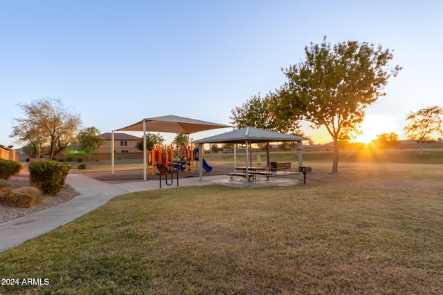 view of community with a playground and a yard