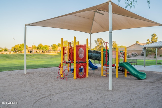 view of jungle gym with a lawn