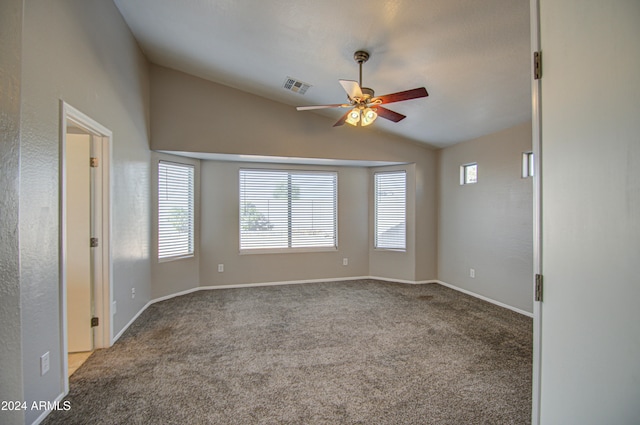 carpeted empty room featuring ceiling fan and lofted ceiling