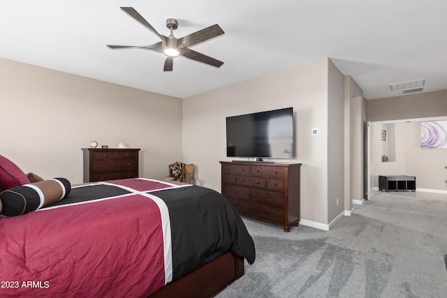 bedroom featuring ceiling fan and light carpet