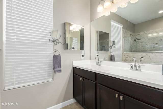 bathroom featuring vanity and a tile shower