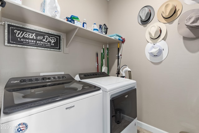 washroom with washer and dryer