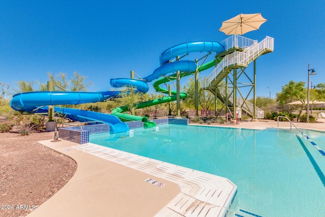 view of pool featuring a water slide