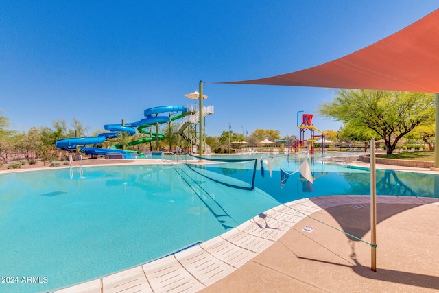 view of pool with a water slide