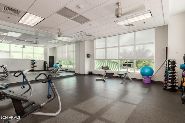 exercise room with a paneled ceiling