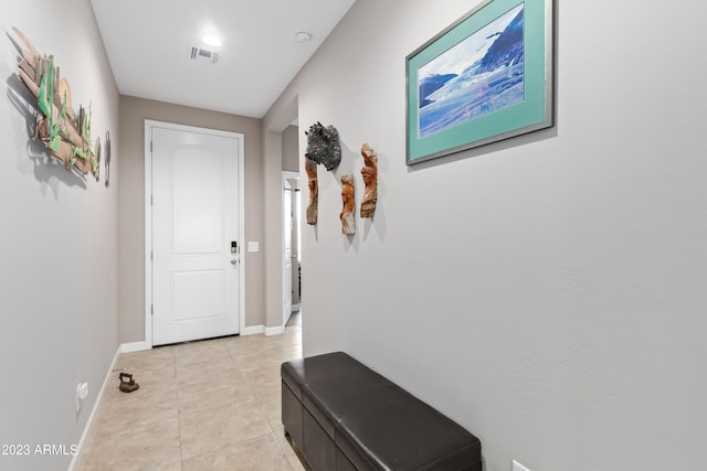 hall with light tile patterned flooring