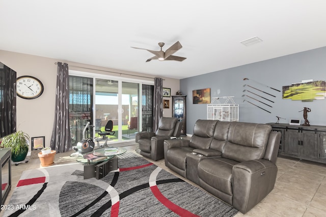 tiled living room featuring ceiling fan