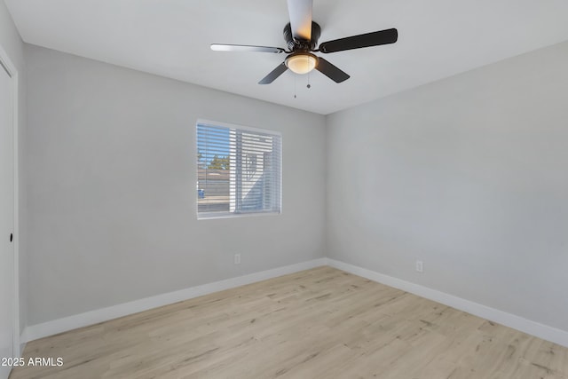 unfurnished room with light wood-type flooring and ceiling fan