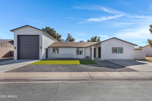 single story home featuring a front yard and a garage