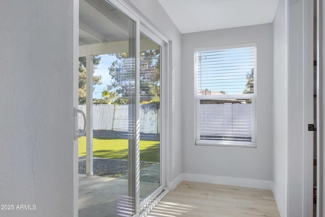 doorway to outside with light hardwood / wood-style flooring