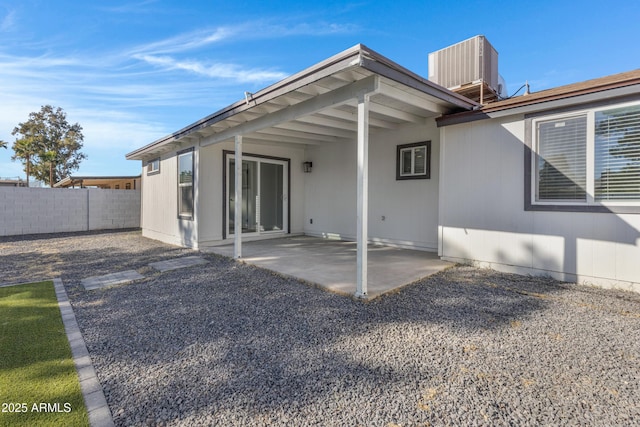 rear view of property featuring central AC and a patio