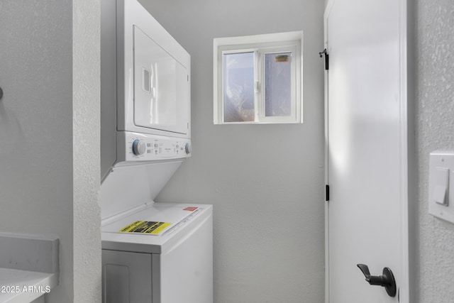 washroom with stacked washer and clothes dryer