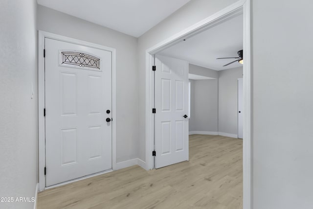 entryway with light wood-type flooring and ceiling fan