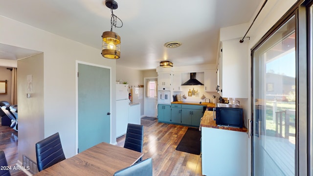 dining area with hardwood / wood-style floors