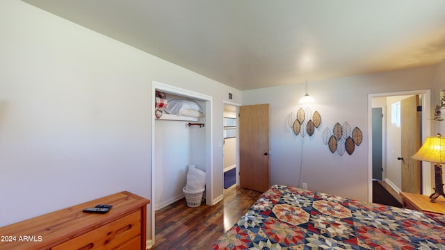 bedroom with dark hardwood / wood-style floors