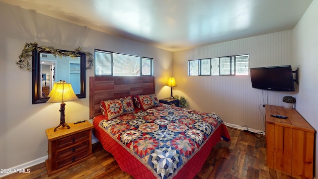 bedroom featuring dark hardwood / wood-style flooring