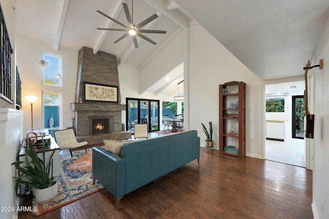 living room with a fireplace, dark hardwood / wood-style flooring, high vaulted ceiling, and beamed ceiling