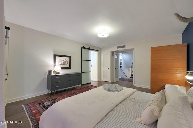 bedroom featuring dark wood-type flooring