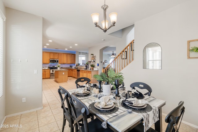 dining space featuring a chandelier and light tile patterned floors