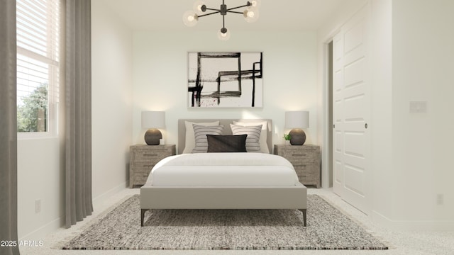 carpeted bedroom featuring baseboards